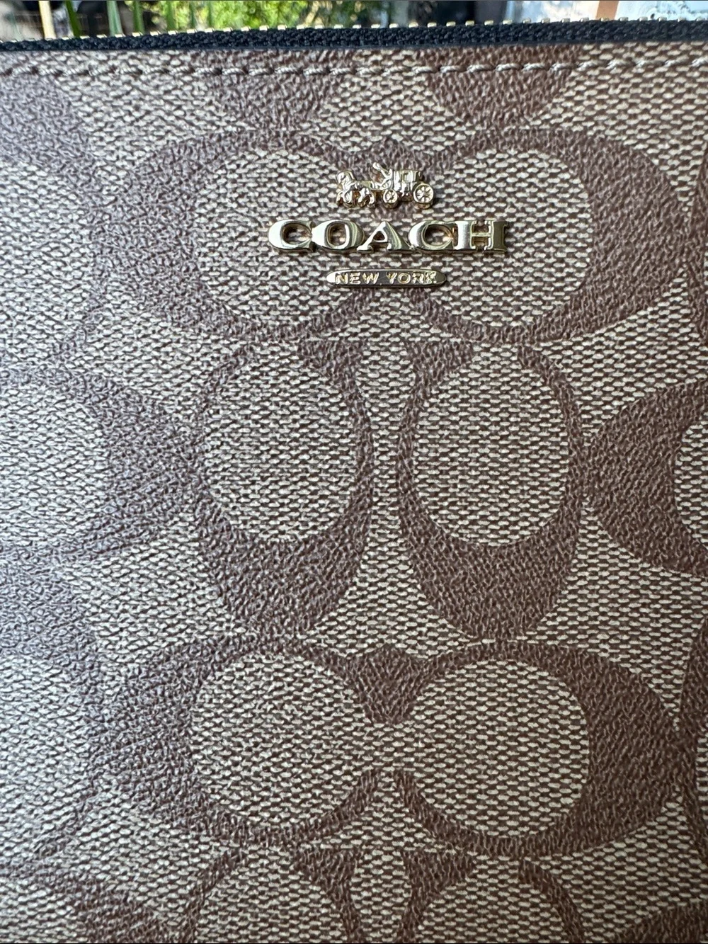Coach wristlet featuring